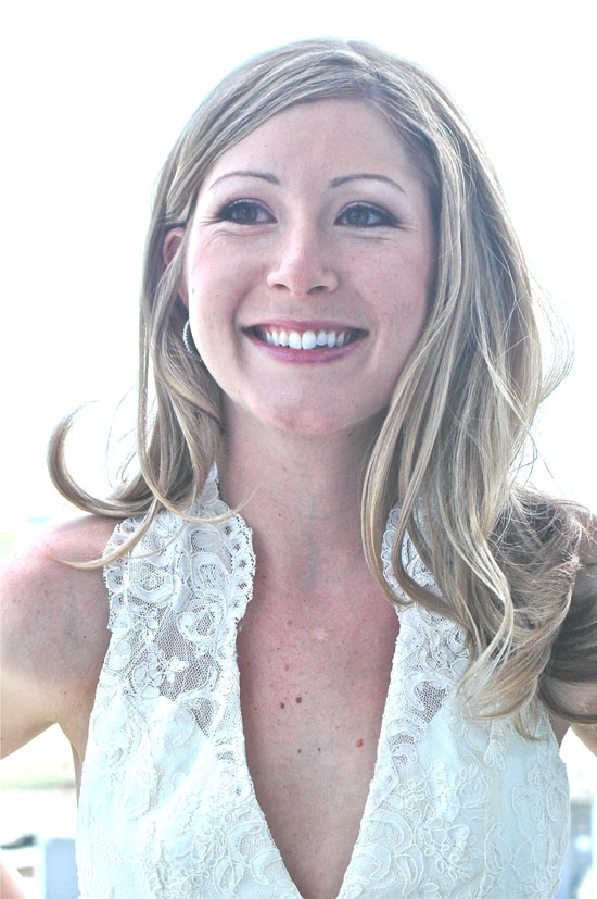 Smiling bride in a beautiful lace wedding dress