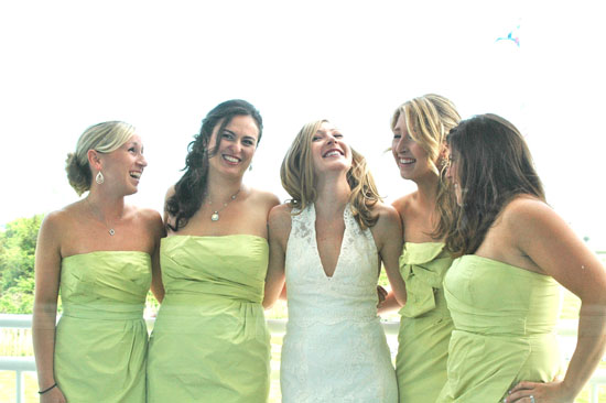 Happy bridesmaids in light green dresses at wedding