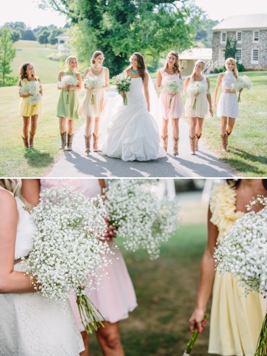 Bride and bridesmaids in pastel dresses with baby's breath bouquets