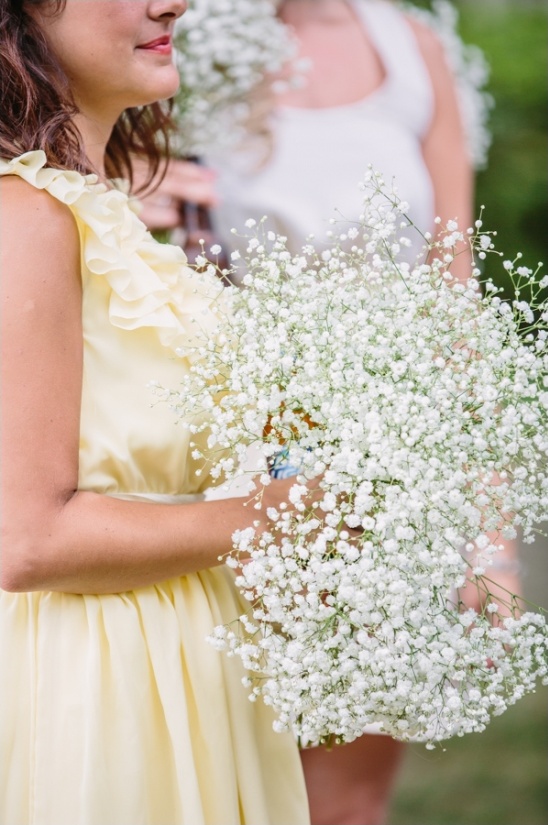 Bridesmaid holding a large baby's breath bouquet