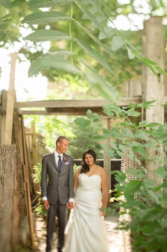 Bride and groom holding hands outdoors on wedding day