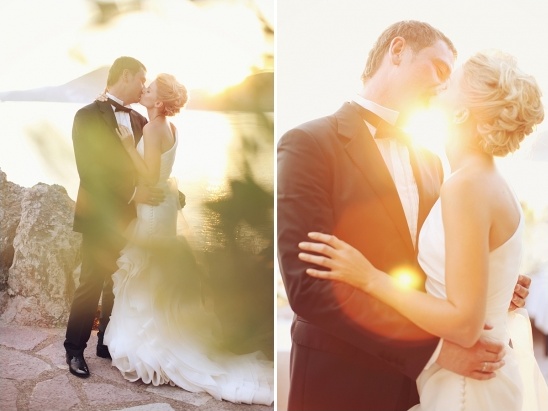 Romantic wedding kiss with sunset glow and a gorgeous dress