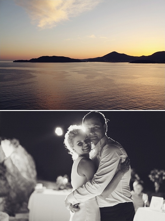 Couple dancing at wedding, sunset over ocean in background