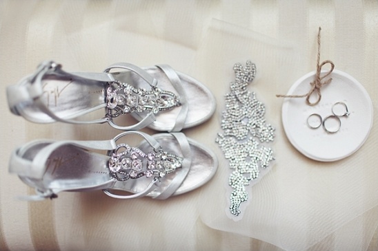 Silver wedding shoes, jewelry, and rings, bridal details, elegant setup