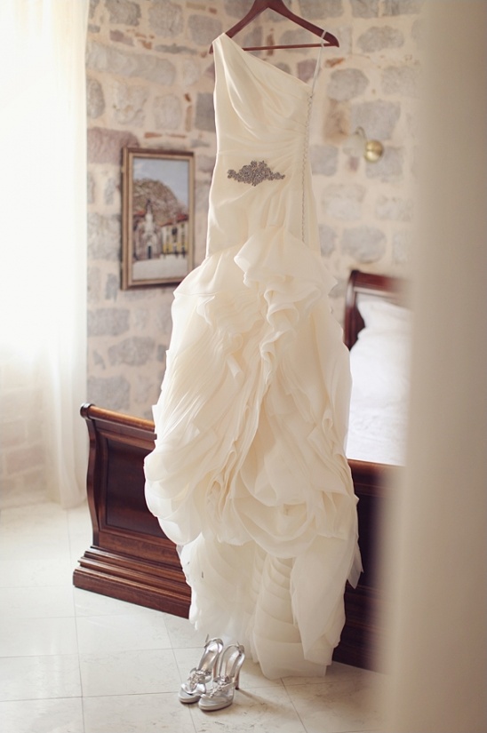 Elegant wedding dress with detailed bodice and ruffle skirt
