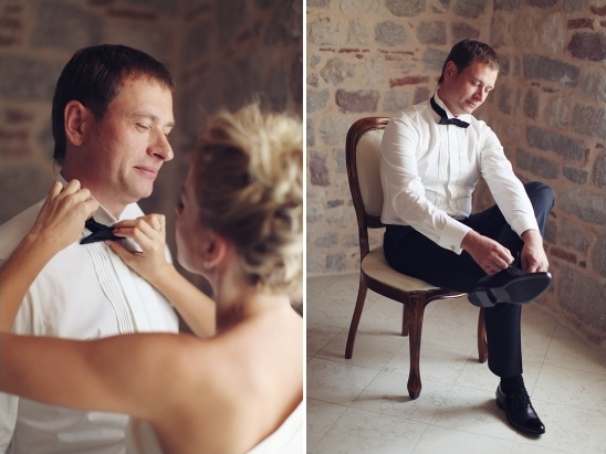 Groom getting ready for his wedding day with bride's help and shoes
