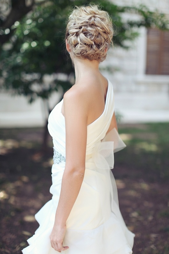 Elegant bride in a white wedding dress with updo hairstyle