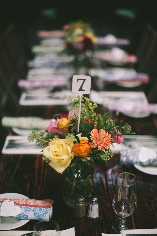 Table setting with floral centerpiece and table number 7