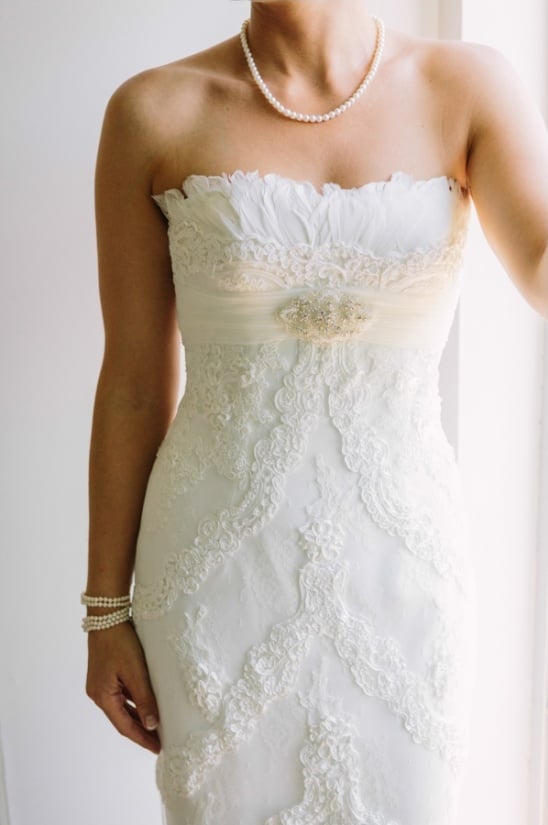 pronovias strapless wedding dress with feather top