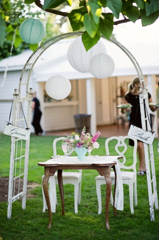 Garden wedding reception decor with lanterns and flowers