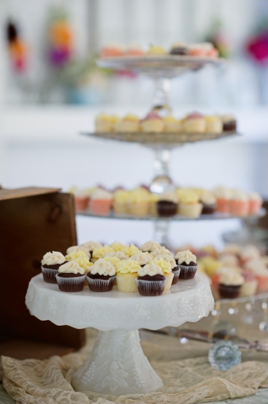 Mini cupcakes on tiered serving stands for a party