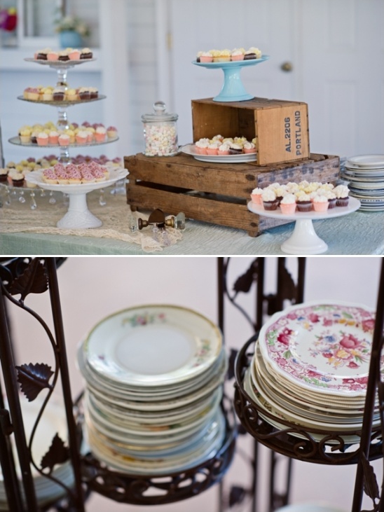 Vintage dessert table with cupcakes and stacked plates