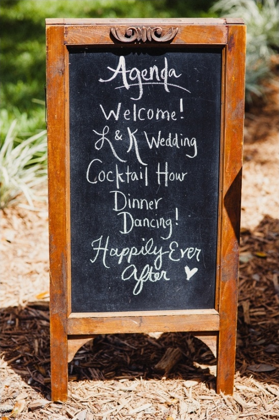Rustic wedding agenda chalkboard sign outdoor