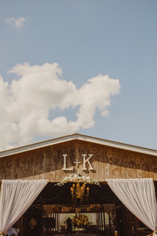 Barn wedding venue with L and K initials at entrance