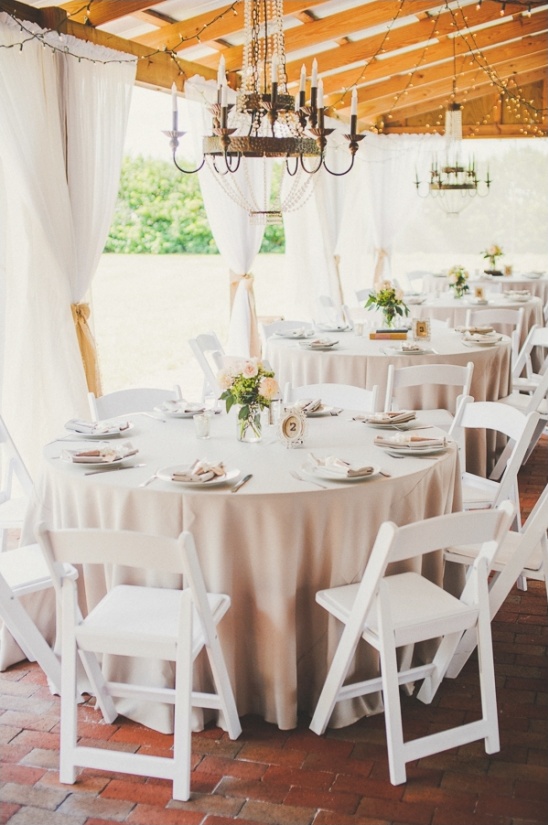 Elegant outdoor wedding reception with white decor