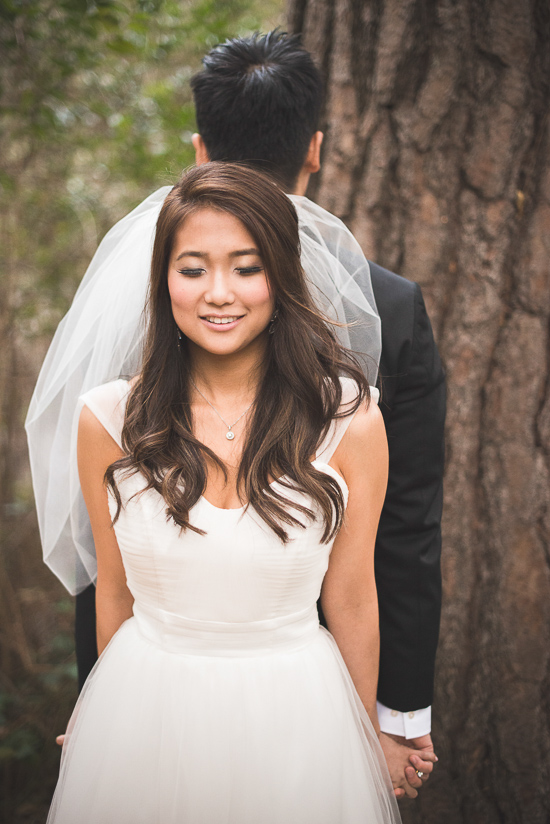 Bride and groom holding hands on their wedding day in nature