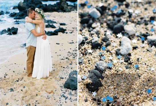 Couple embracing on beach with blue stars and rocks near water