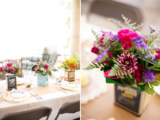 Wedding table decor with flowers in vintage tea tins