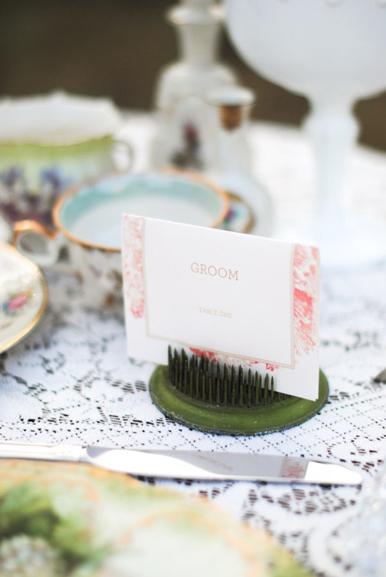 Wedding table setting detail with groom place card