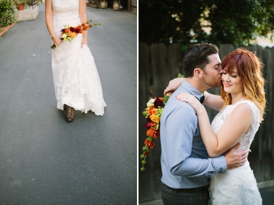 Bride and groom embrace at wedding with beautiful bouquet