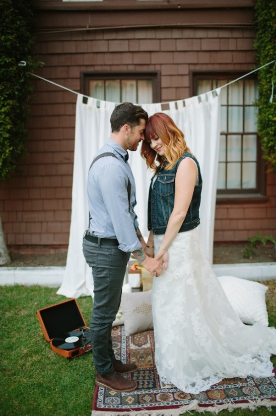 Romantic couple holding hands at outdoor wedding ceremony