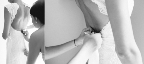 Bridesmaid helping bride fasten wedding dress for the ceremony