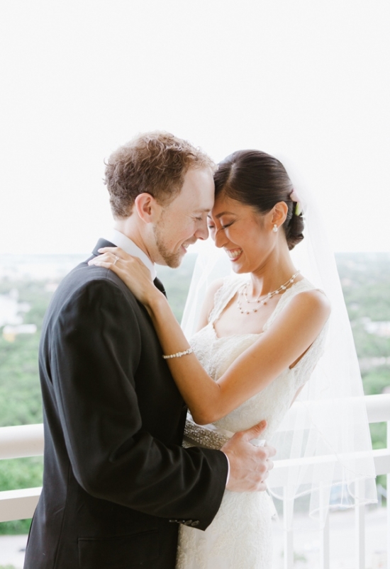 Happy smiling couple sharing a tender moment on their wedding day