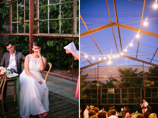 Bride cries during a wedding speech at an outdoor reception