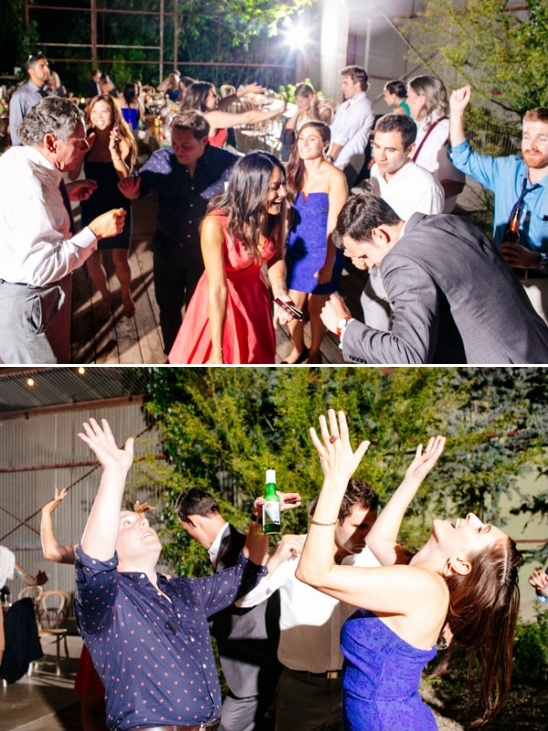 People dancing and celebrating at a party in a lively atmosphere