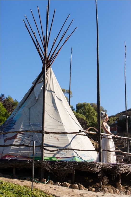 Native American teepee with woman