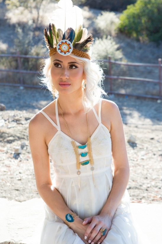 Woman in boho dress with feather headband