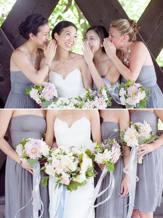 Happy bride sharing secrets with bridesmaids on her wedding day