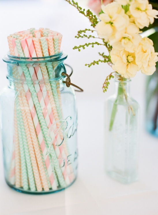 striped straws in blue mason vase