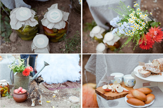 Outdoor wedding reception with food flowers and cat