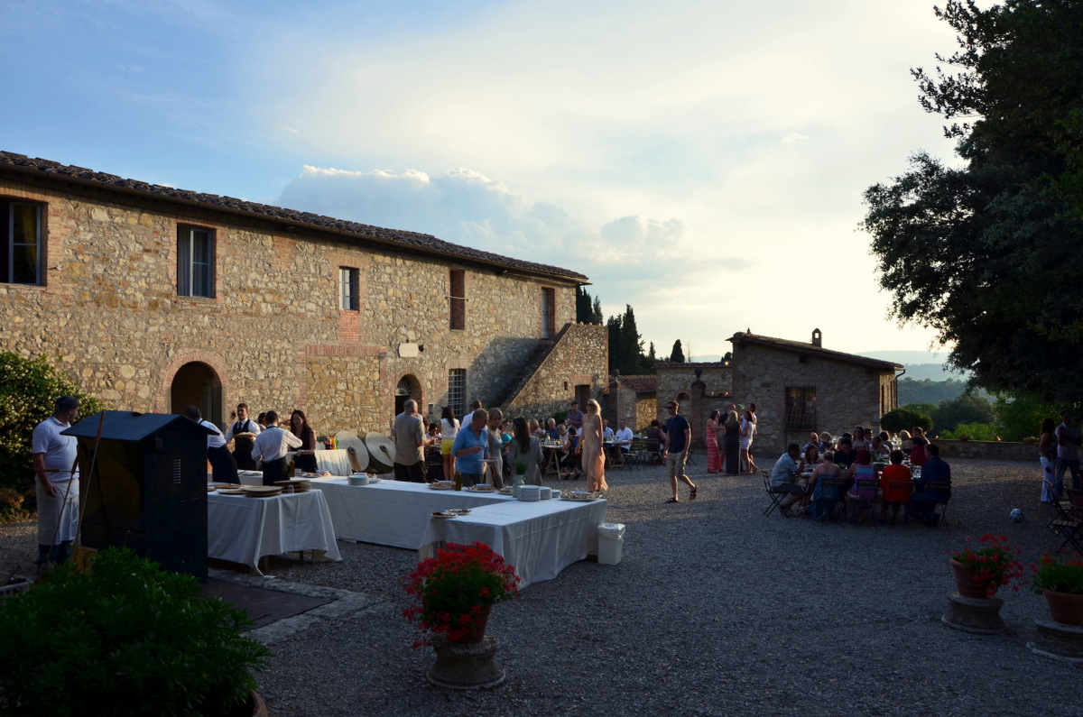 Outdoor dinner party at a beautiful stone building in Italy