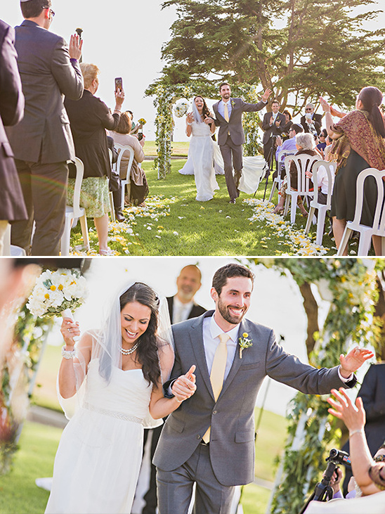 Newly married couple celebrating with guests after their wedding