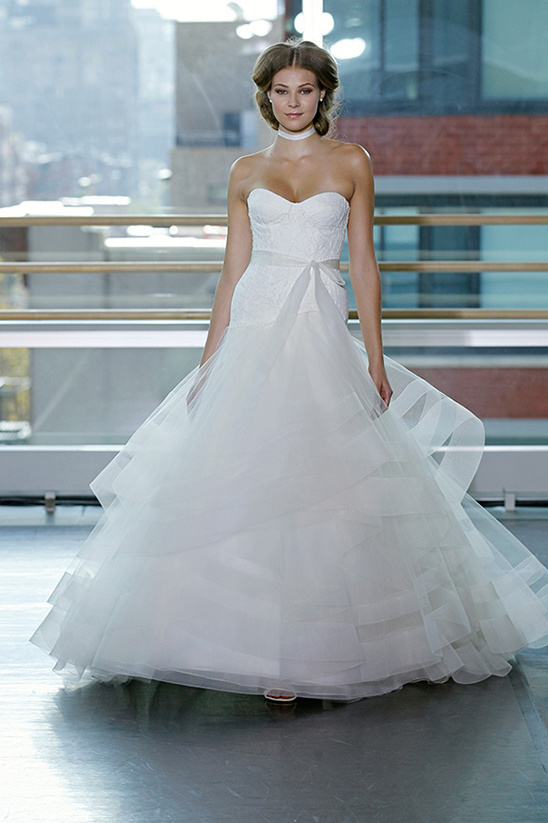 Elegant bride in a beautiful strapless white wedding gown