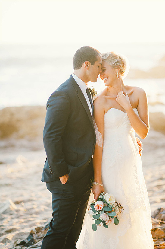 Bride and groom sharing a tender moment on their wedding day
