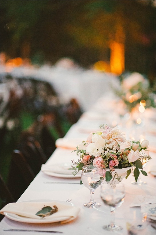 Elegant wedding table setting with floral centerpiece and place settings