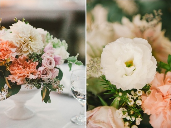 Floral arrangement with white and peach flowers on a table