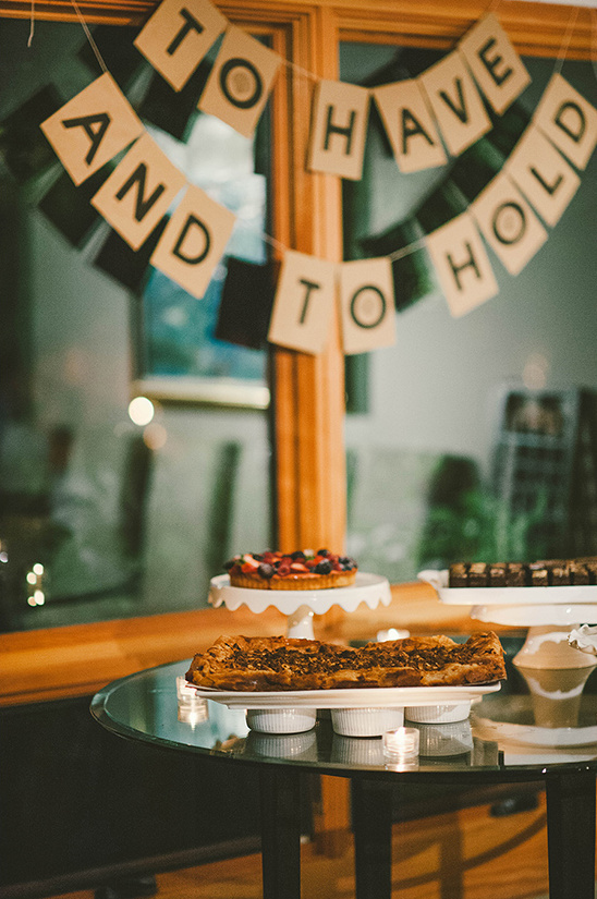 Wedding dessert table with a to have and to hold banner