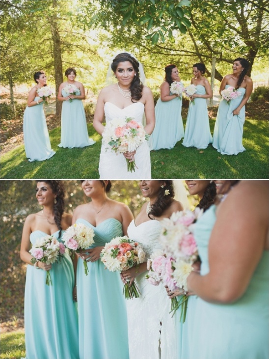 Bride with bridesmaids in mint dresses, holding floral bouquets