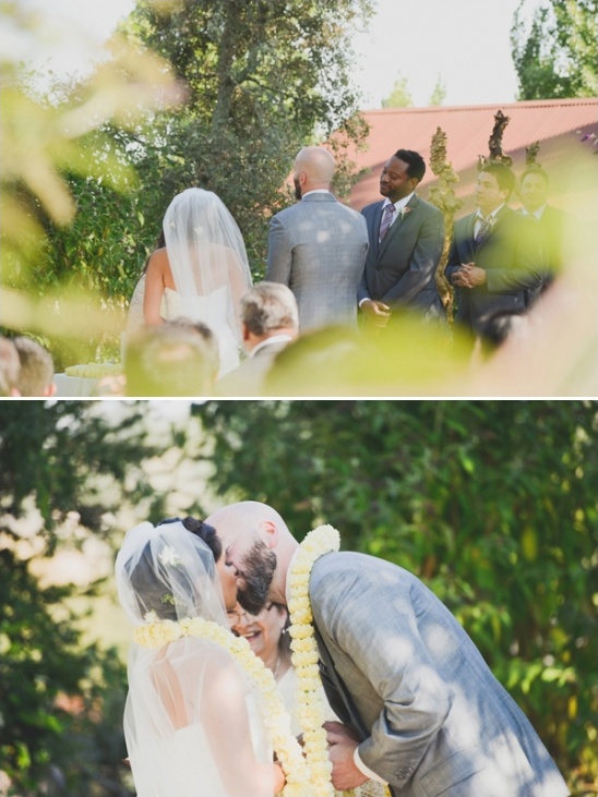 Wedding ceremony vows exchange with loving kiss outdoor