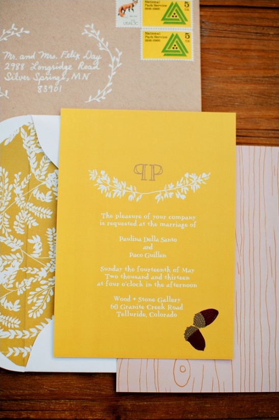 Elegant yellow wedding invitation with leafy accents