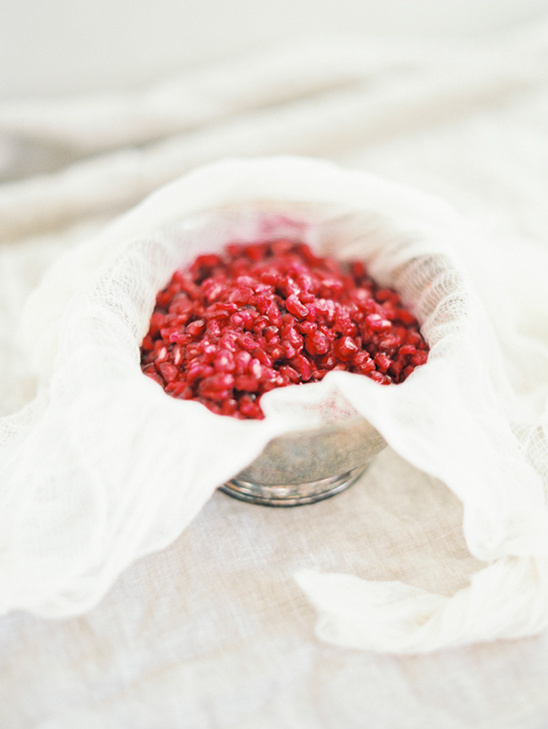 Red seeds in a strainer bowl