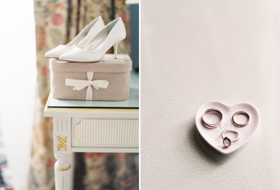 White bridal heels and wedding rings on display