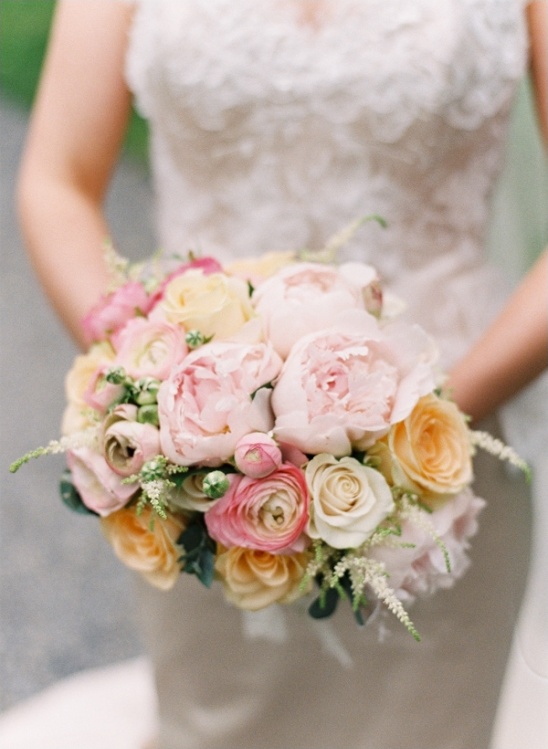 Pretty pastel wedding bouquet with roses and peonies