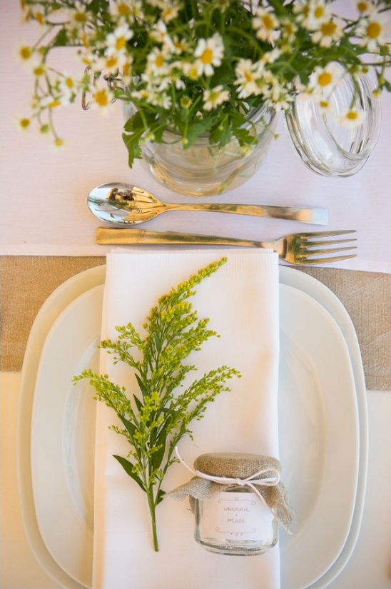 Elegant wedding table setting with flowers and favors