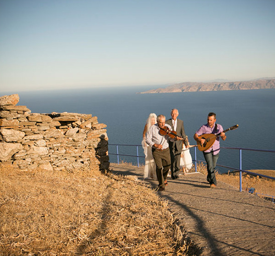 Greek island wedding processional with musicians