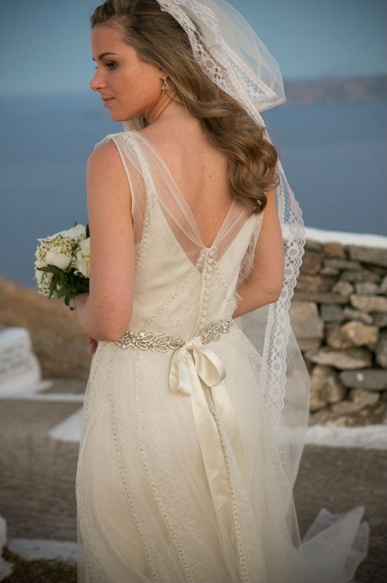 Bride in beautiful lace wedding dress with veil